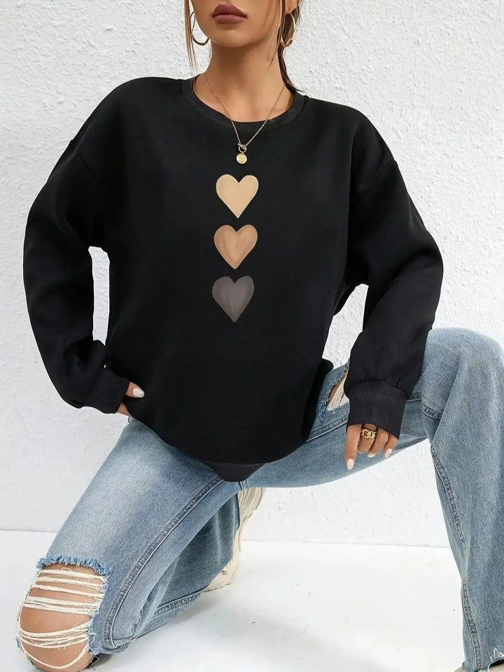 Felpa da donna calda con stampa cuore oversize, ideale per l'autunno-inverno.