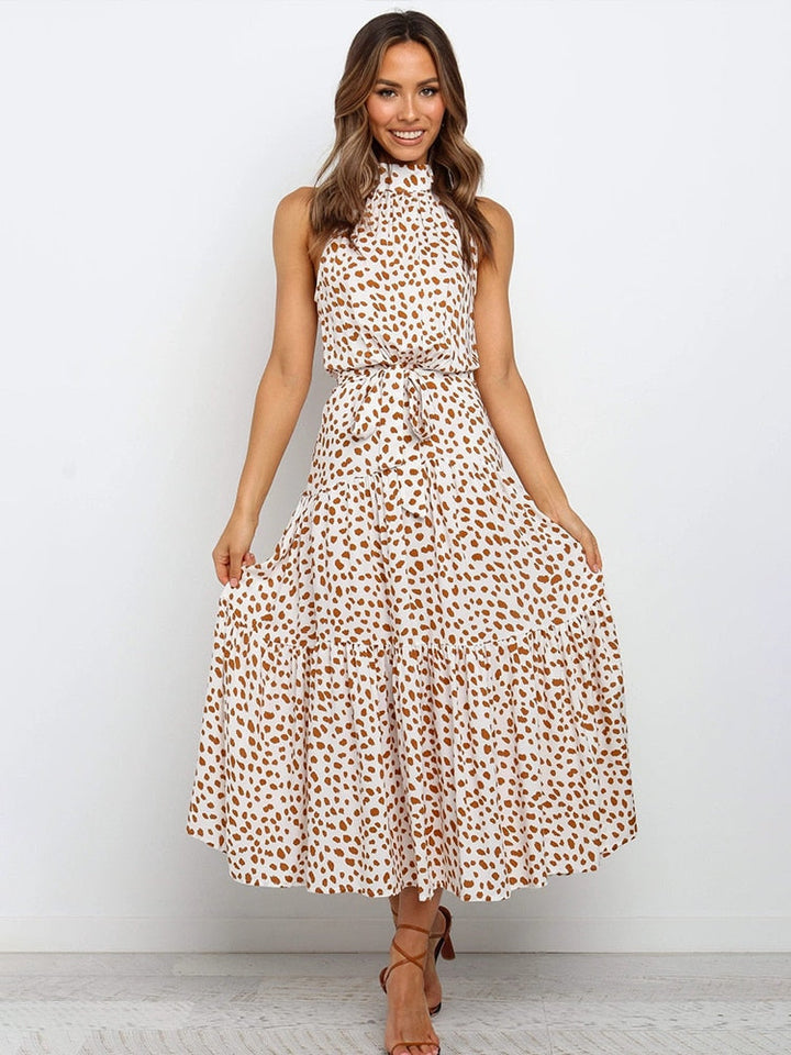 Abito estivo midi svasato a pois, confortevole ed elegante per look casual o serali. Moda donna.