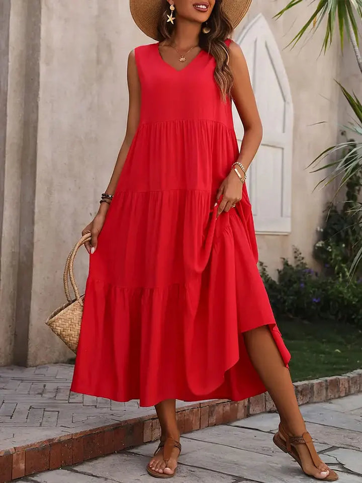 Abito lungo casual da donna con balze e scollo a V, perfetto per un outfit estivo rilassato.