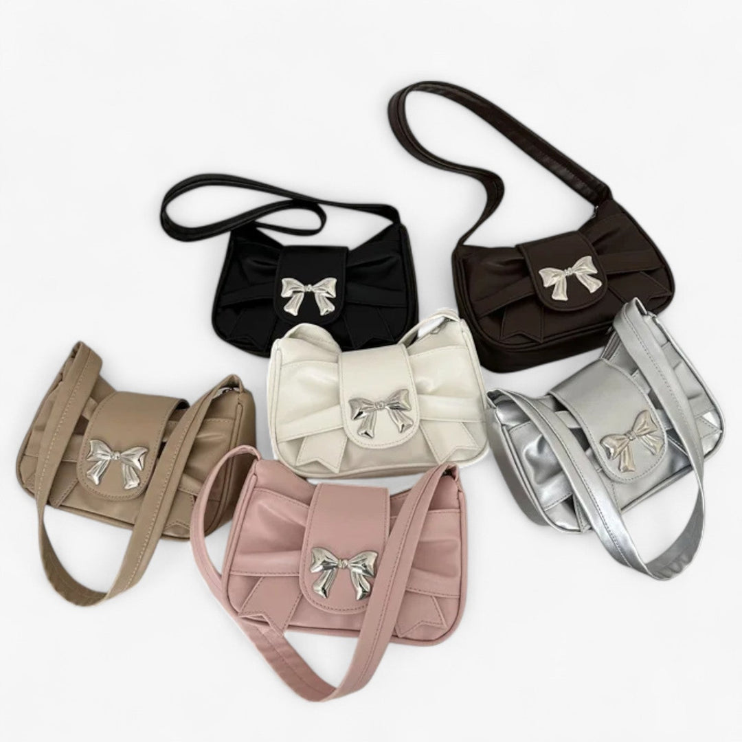 Pochette da donna, prospettiva dall'alto, enfatizzando design pulito ed elegante minimalismo.