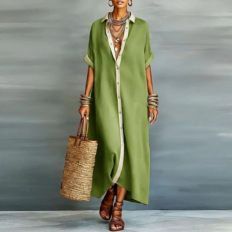 Stiloso abito chemisier lungo da donna con silhouette ampia e bottoni, capo essenziale per la moda primavera estate.