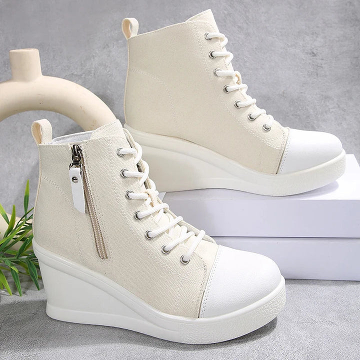 Sneakers donna zeppa nascosta, con zip e lacci, aggiungono un tocco di eleganza al tuo outfit casual.