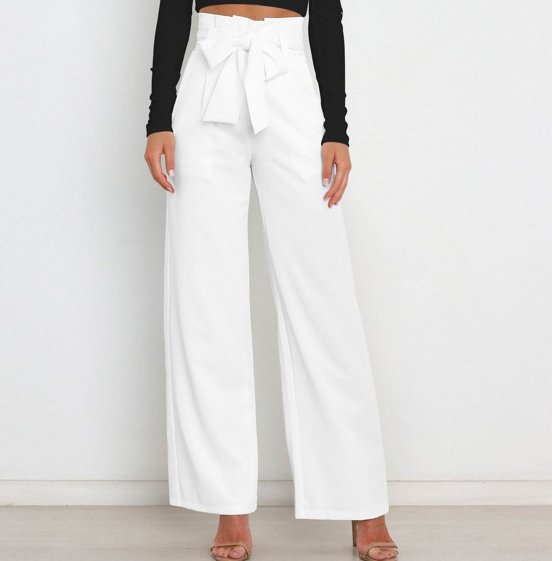 Silhouette slanciata con pantaloni larghi a vita alta donna e cintura. Stile raffinato.