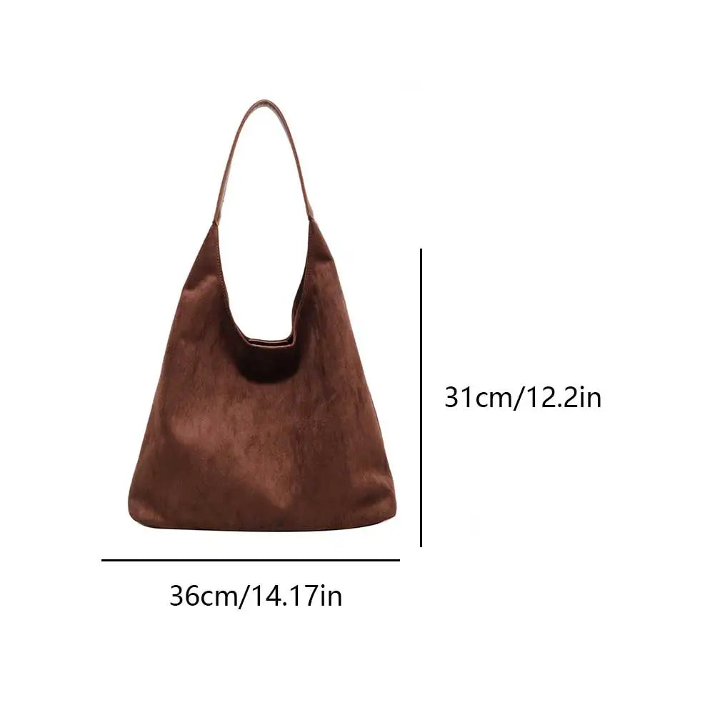 Borsa tote in pelle scamosciata marrone, con dettagli chic, un accessorio donna elegante.