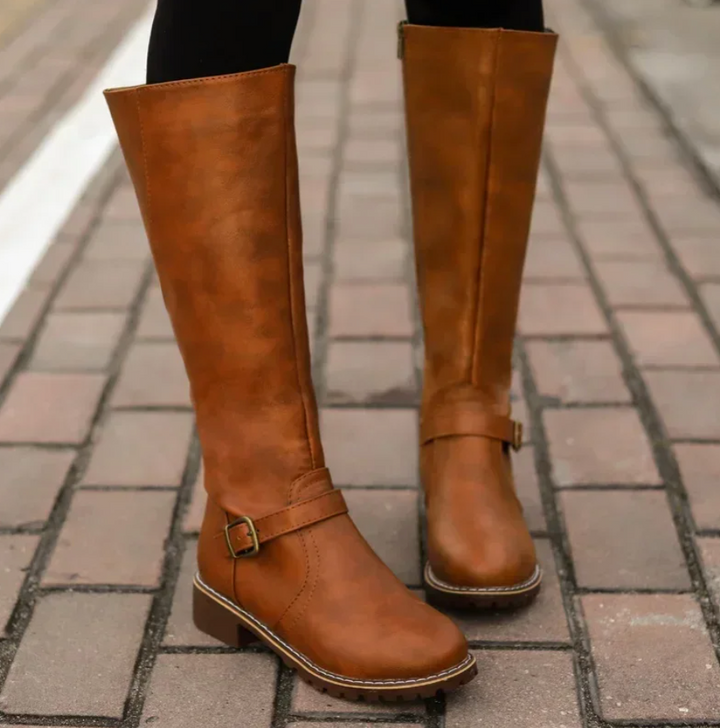 Stivali donna eleganti neri con tacco basso, ideali per comfort e stile invernale, calzature versatili.