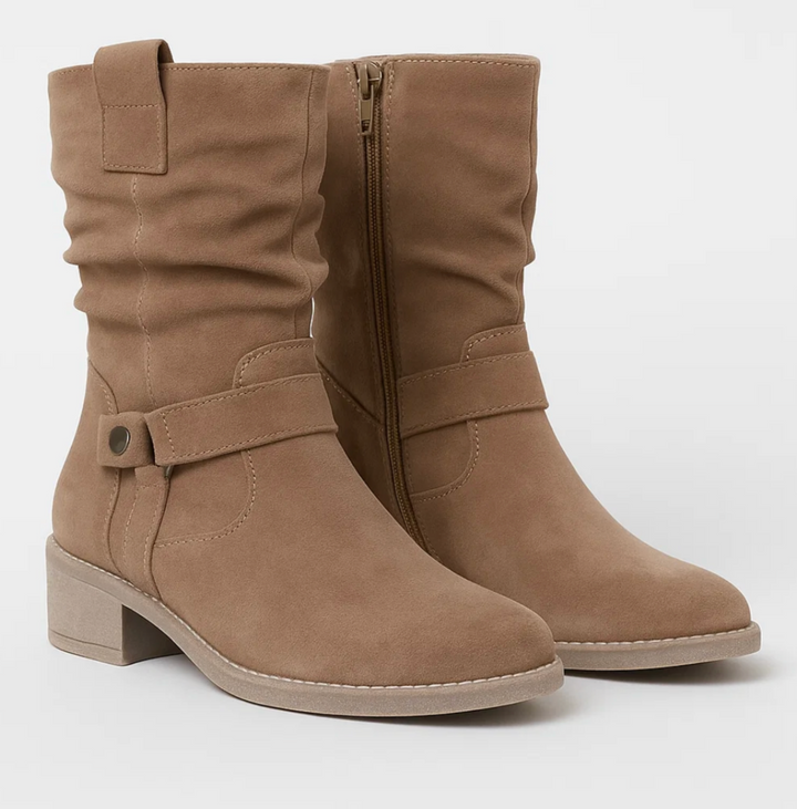 Stivaletti donna con tacco basso e zip laterale, design versatile ed elegante per l'inverno.