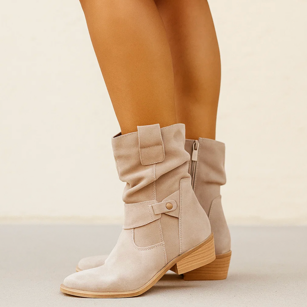 Eleganti stivaletti donna invernali con tacco basso e pratica zip laterale, comfort assicurato.