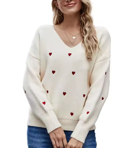 Maglione donna elegante a V con cuori, in maglieria per comfort e stile femminile autunnale.