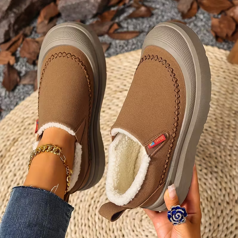 Stivali invernali da donna slip-on, design elegante e supporto plantare, perfetti per l'inverno.