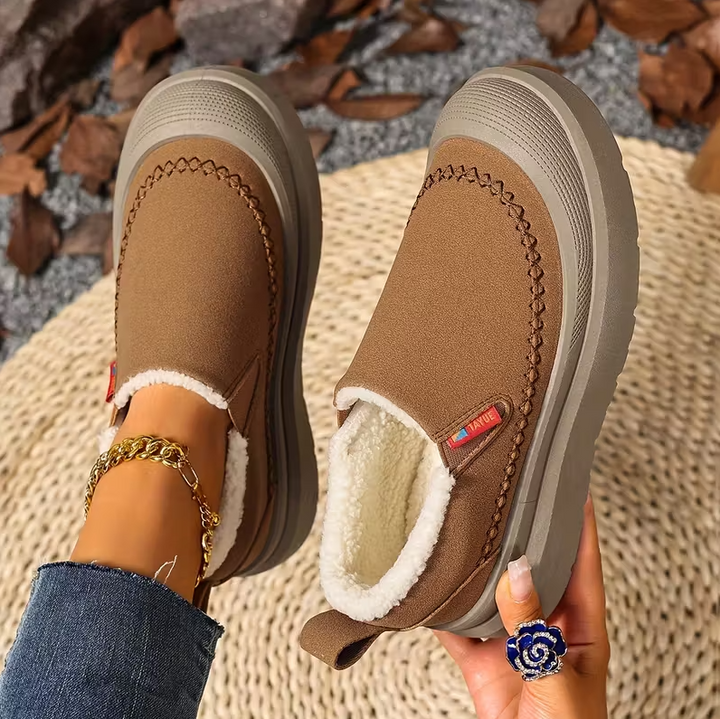 Stivali invernali da donna slip-on, design elegante e supporto plantare, perfetti per l'inverno.