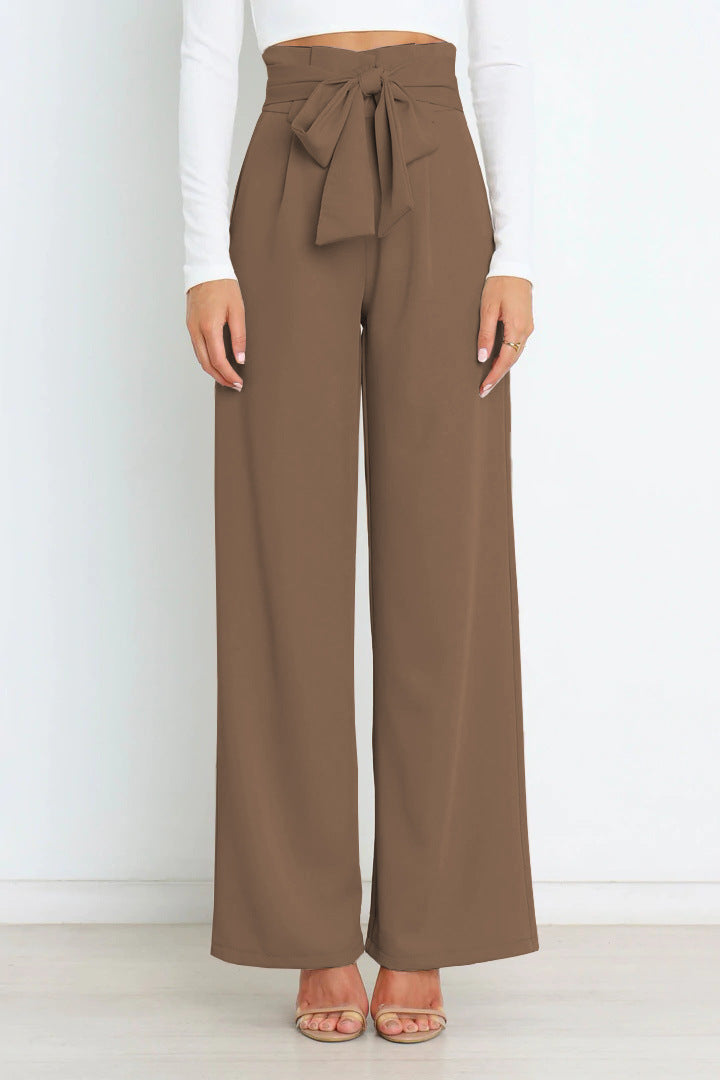Pantaloni casual donna a gamba larga, vita alta e cintura per comfort e stile quotidiano.