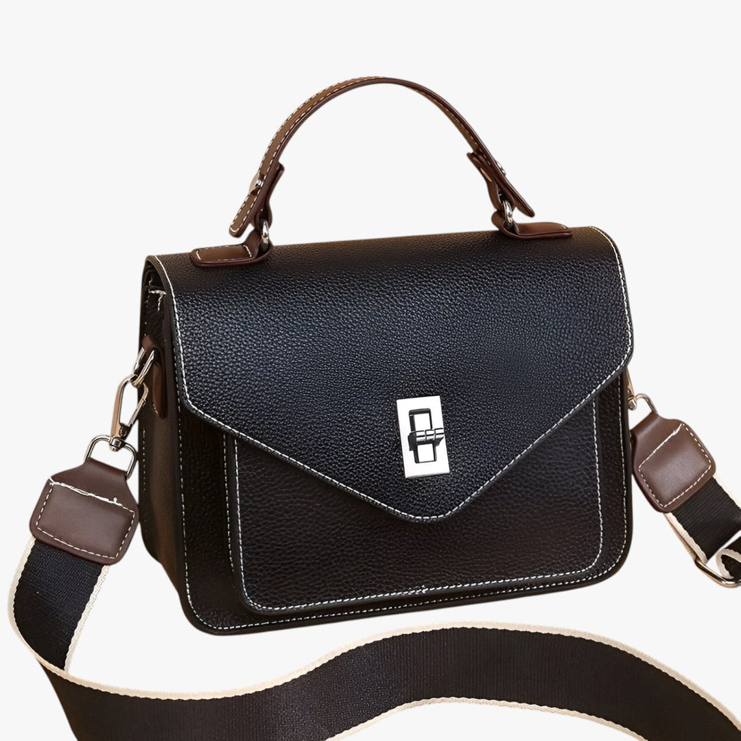 Moderna borsa a mano multicolore, accessorio da viaggio versatile per look casual ed eleganti.
