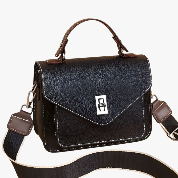 Moderna borsa a mano multicolore, accessorio da viaggio versatile per look casual ed eleganti.
