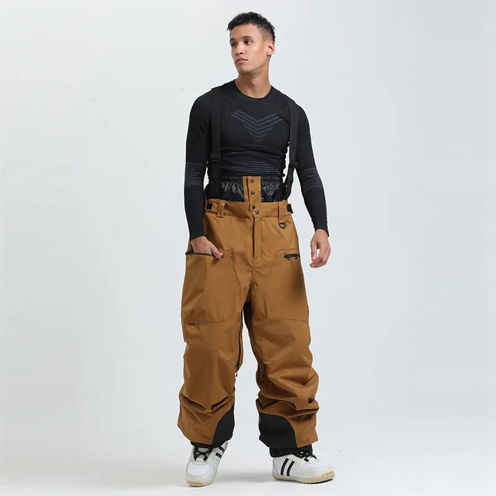 Pantaloni da snowboard unisex verdi, impermeabili e con bretelle, ideali per il freddo intenso.