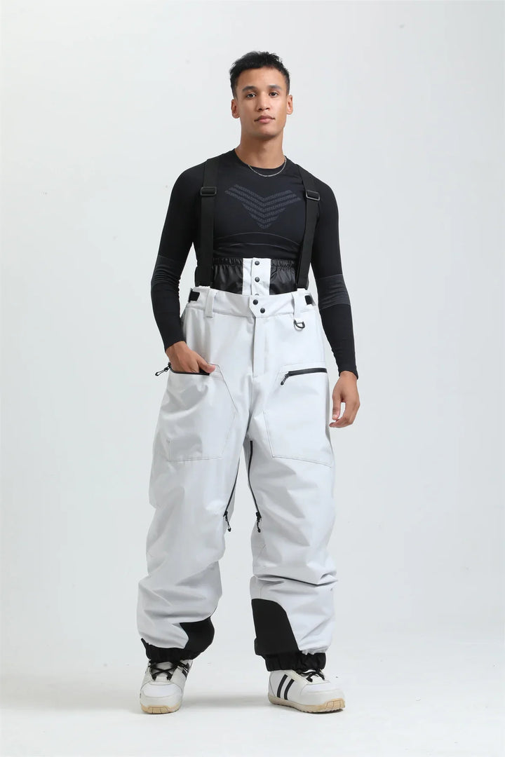 Pantaloni da sci unisex neri, impermeabili e con bretelle, ideali per freddo estremo sulla neve.