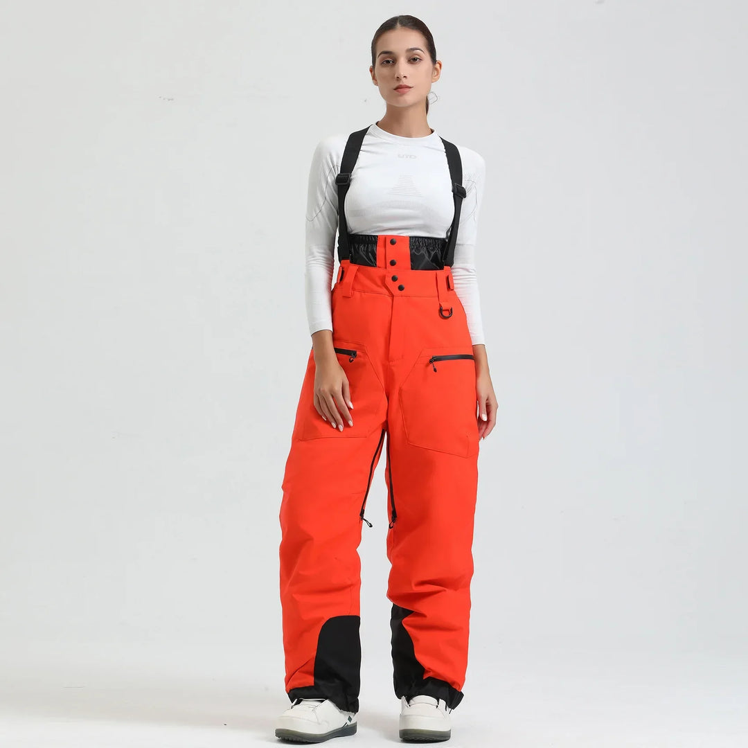 Pantaloni da sci unisex azzurri, impermeabili e con bretelle, per proteggere dal freddo estremo.