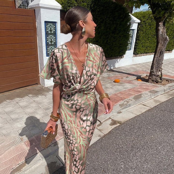 Elegante abito midi donna floreale con scollo a V, ideale per primavera estate. Vestito femminile casual chic con drappeggio.