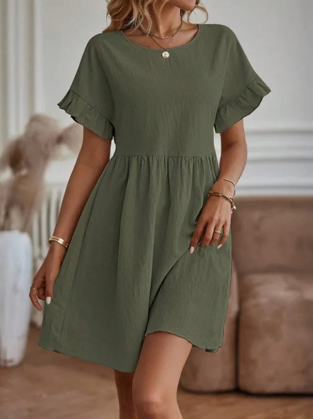Abito corto donna estivo e leggero con scollo tondo, per un look casual-chic e moda femminile primavera.