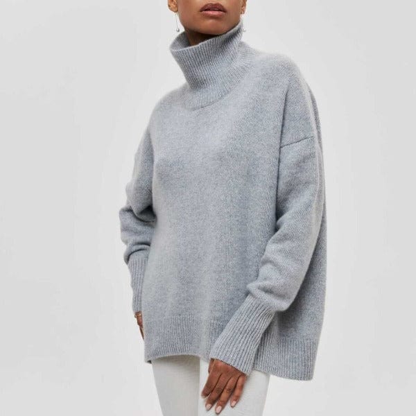 Maglione aderente donna collo alto, maniche lunghe. Un capo moda femminile essenziale per ogni guardaroba autunnale.