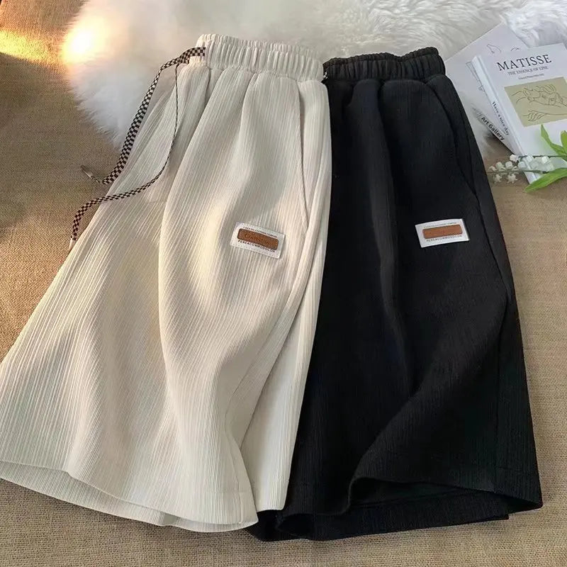 Shorts sportivi unisex leggeri e traspiranti, ideali per allenamento e tempo libero. Quick dry.