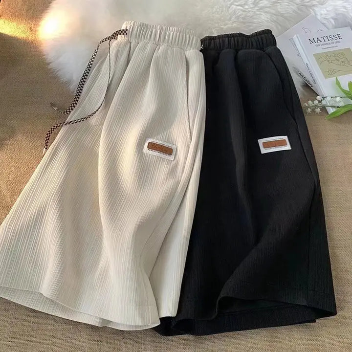 Shorts sportivi unisex leggeri e traspiranti, ideali per allenamento e tempo libero. Quick dry.