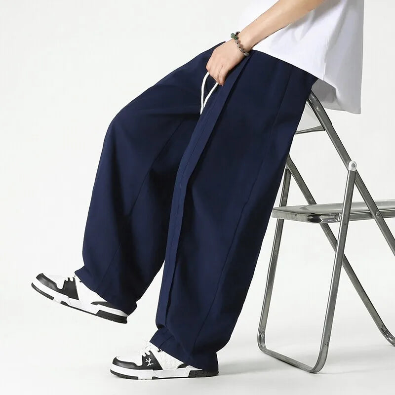 Pantaloni uomo casual streetwear a gamba larga con coulisse, perfetti per un look moderno e confortevole.
