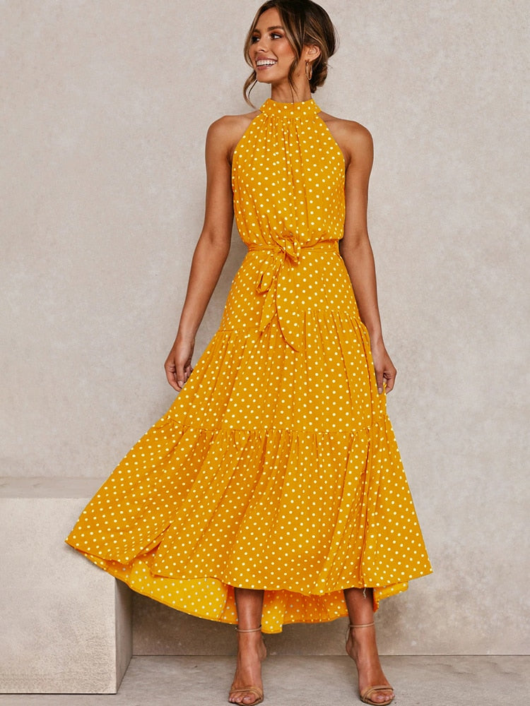 Abito midi a pois versatile, elegante per il giorno e la sera. Con cintura e taglio svasato, moda donna estiva.