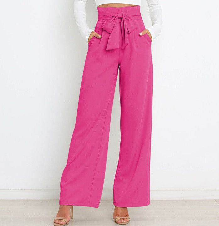 Pantaloni a vita alta donna con gamba larga e cintura a nastro. Essenziale per la moda femminile.