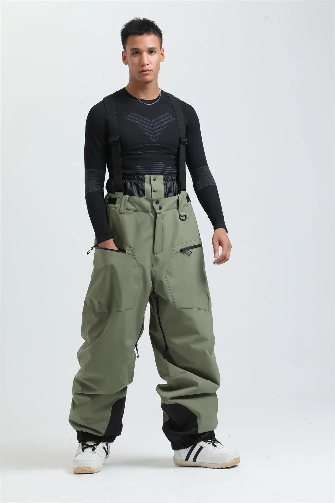 Pantaloni invernali grigi per sci e snowboard, unisex, con bretelle per protezione dal freddo estremo.