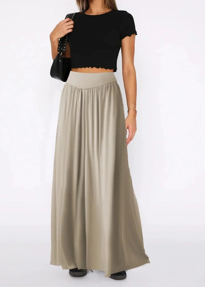 Pantaloni donna morbidi a gamba larga, vita elasticizzata, ideali per outfit estivo casual e confortevole.