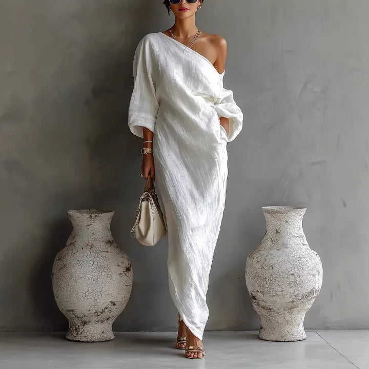 Abito lungo donna elegante monospalla asimmetrico con tasche, ideale per eventi serali o casual.