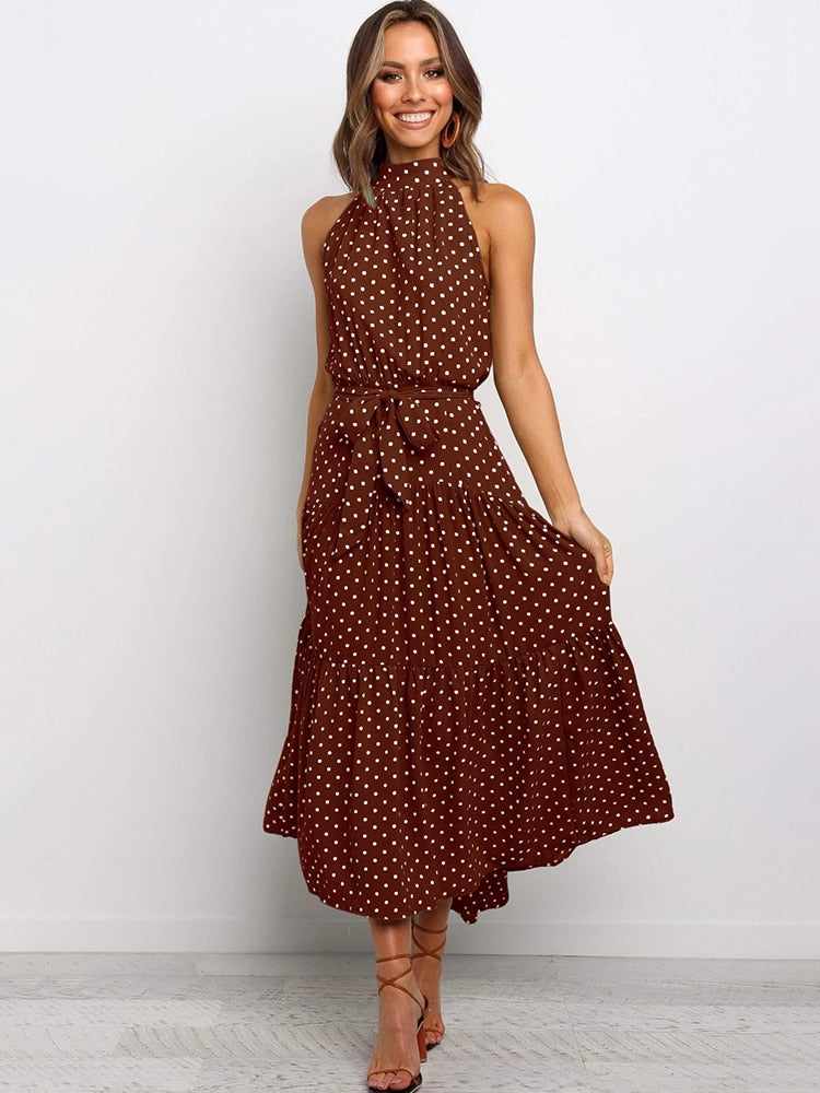 Abito midi svasato a pois da donna, estivo ed elegante. Perfetto per ogni occasione, moda femminile.