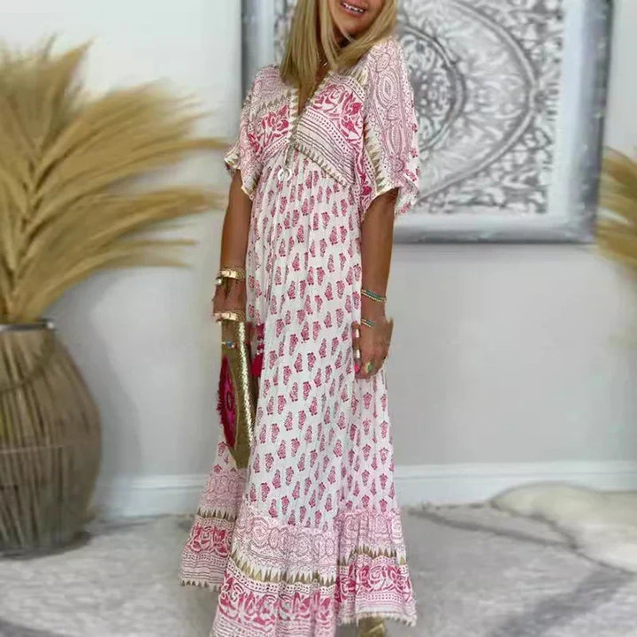 Abito lungo donna estivo bohémien con stampa floreale multicolore e scollo a V, perfetto per look casual.