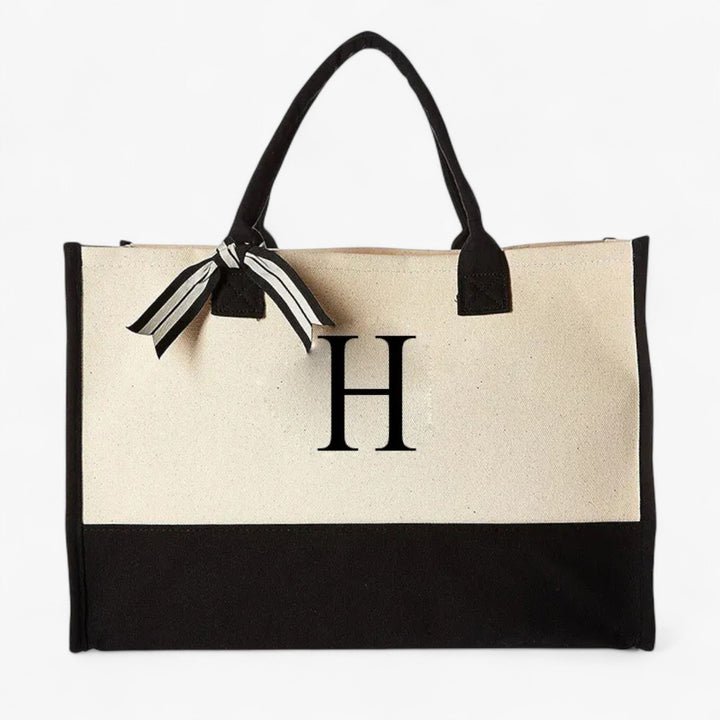 Elegante borsa tote da donna in beige e nero. Personalizzabile con iniziale per un tocco unico.