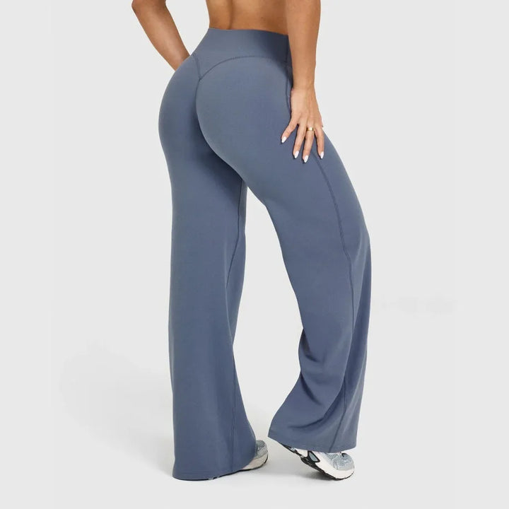 Pantaloni sportivi donna vita alta per yoga e pilates, gamba ampia e tessuto elasticizzato.