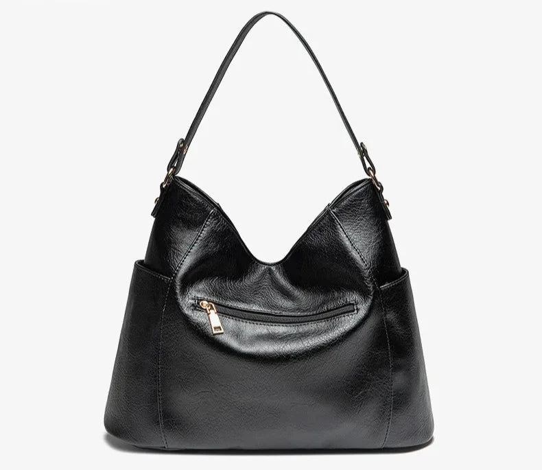 Borsa a mano lussuosa effetto pelle, nera. Un accessorio che combina eleganza e funzionalità quotidiana.
