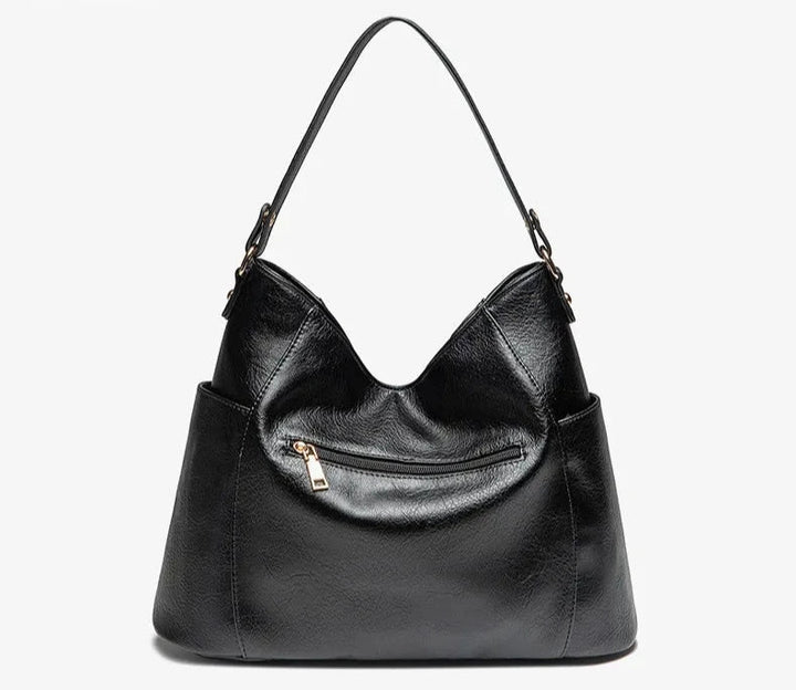 Borsa a mano lussuosa effetto pelle, nera. Un accessorio che combina eleganza e funzionalità quotidiana.