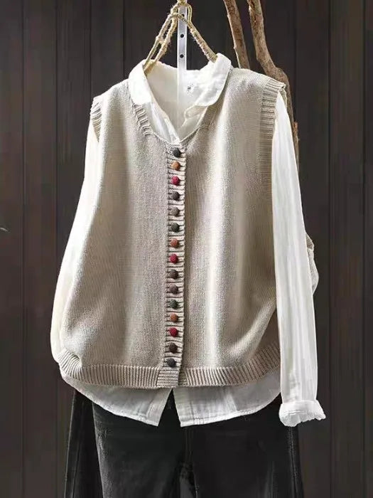 Cardigan donna elegante in maglia con scollo a V e maniche corte, perfetto per un look chic e raffinato.