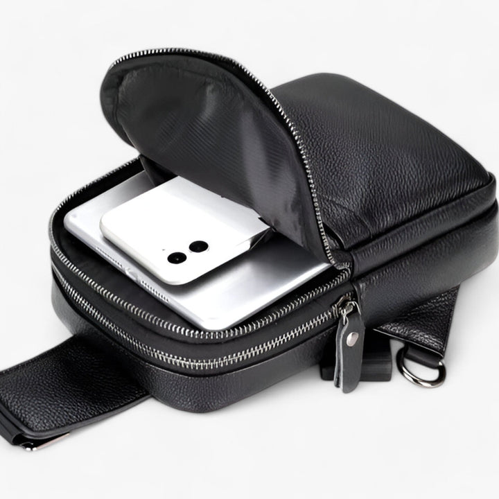 Borsa monospalla marrone unisex, compatta per il viaggio. Tracolla regolabile e scomparti per massima praticità.