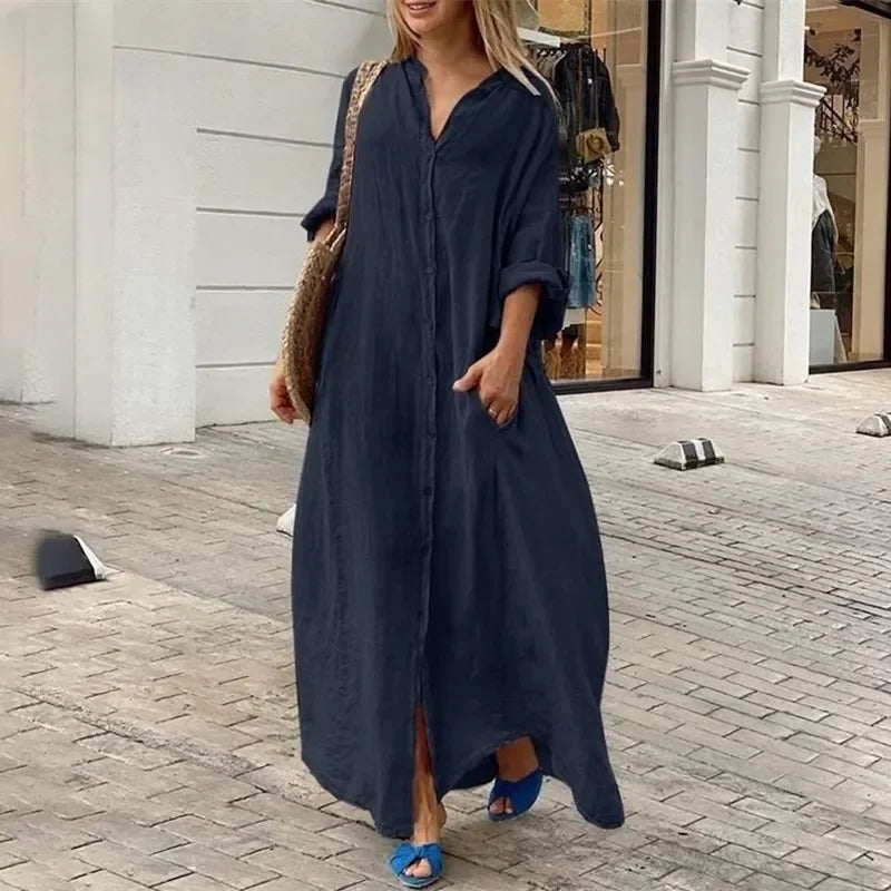 Abito chemisier lungo oversize da donna in lino fluido, ideale per look casual eleganti estivi.