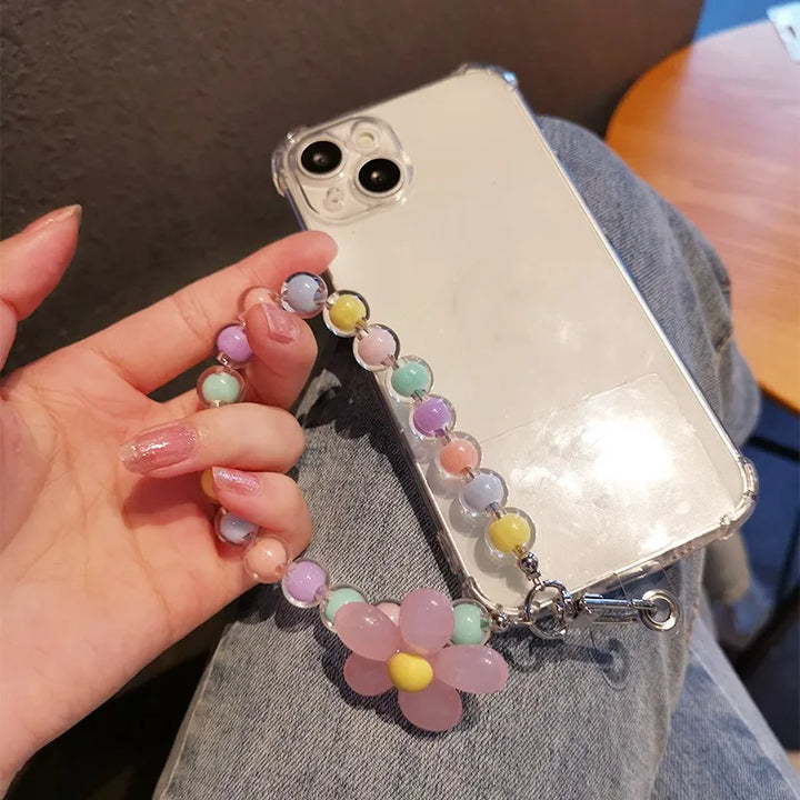 Laccetto smartphone donna con perline colorate stile macaron e fiore, accessorio di tendenza e unico.
