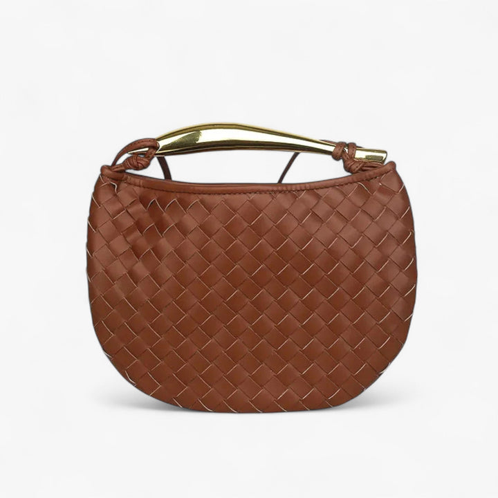 Borsa a mano trapuntata, un must-have per la donna. Eleganza compatta e versatile per ogni outfit.