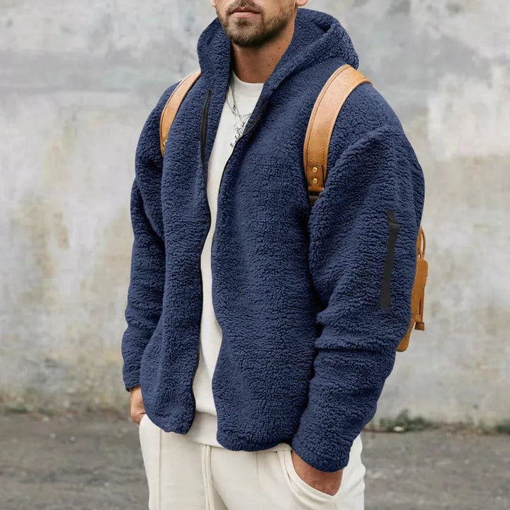 Giacca invernale da uomo blu scuro, con cappuccio, offre stile e protezione dal freddo.