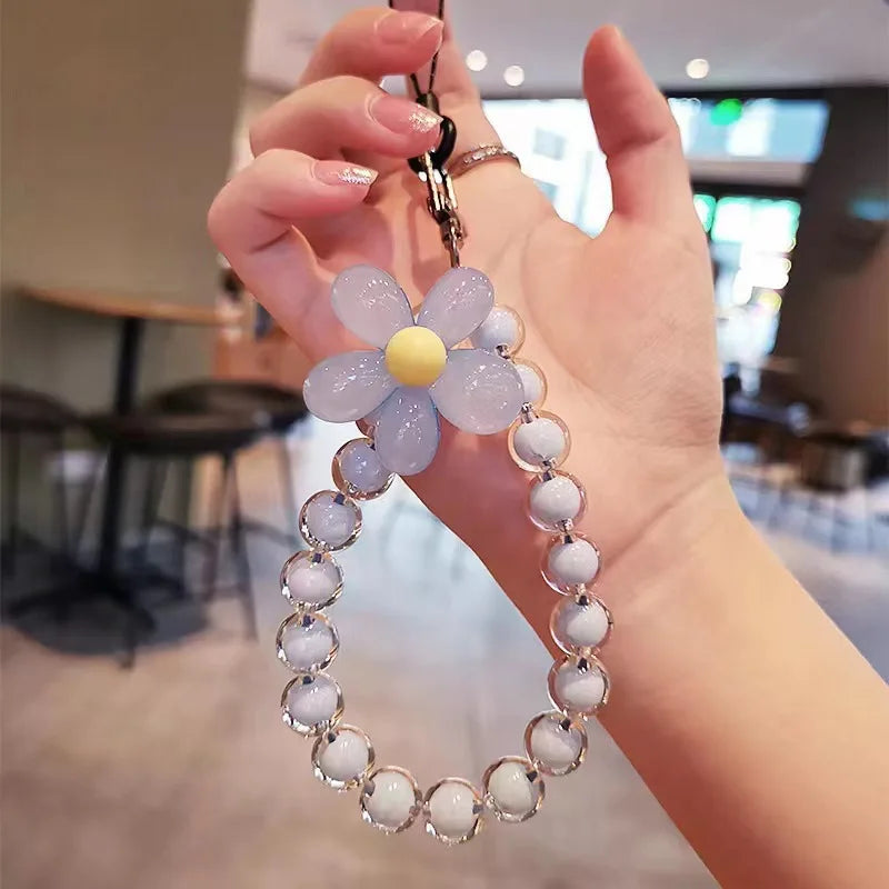 Laccetto colorato per telefono donna, con perline pastello macaron e fiore, stile unico e originale.