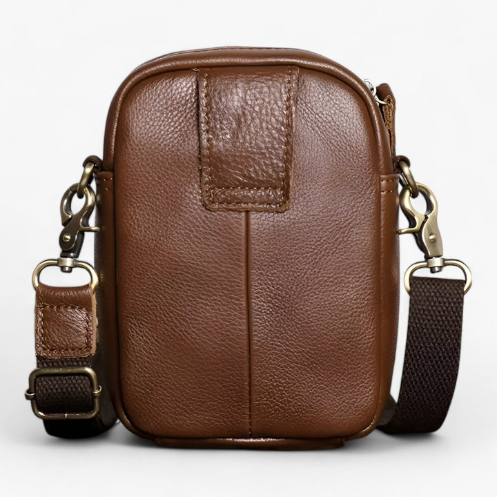 Elegante borsa a tracolla verticale unisex in materiale sintetico, un accessorio moda versatile per adulti.