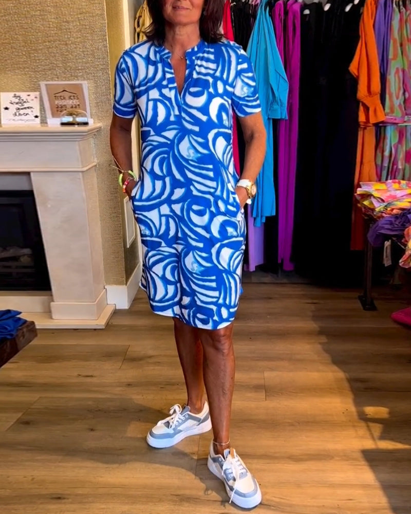 Vestito midi donna estivo, scollo a V, fantasia colorata, ideale per comfort e stile versatile nelle giornate calde.
