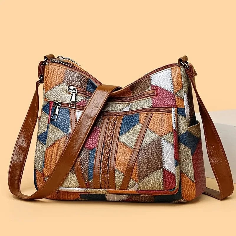 Elegante borsa a tracolla da donna in vera pelle marrone, accessorio moda versatile per ogni look.