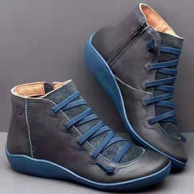 Eleganti stivaletti donna moda con lacci frontali e pratica zip, ideali per la stagione fredda e zeppa confortevole.