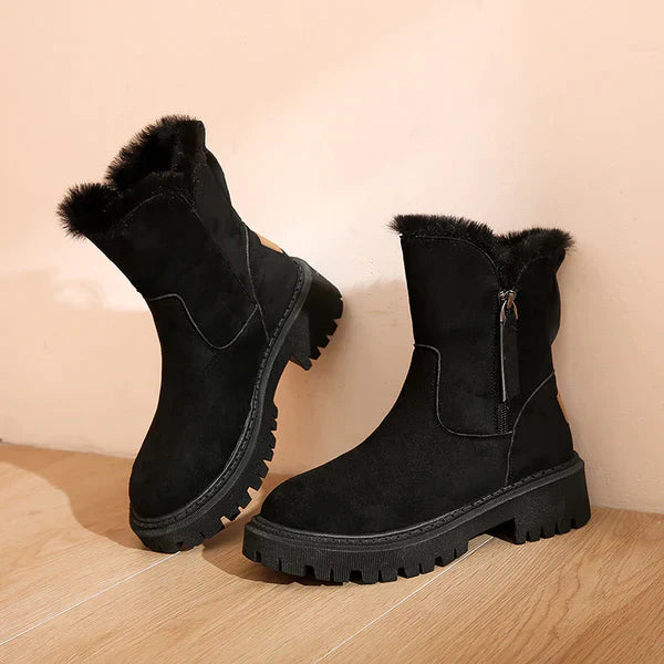Stivaletti invernali donna neri con zip laterale, fodera calda e suola carrarmato. Perfetti per l'inverno.