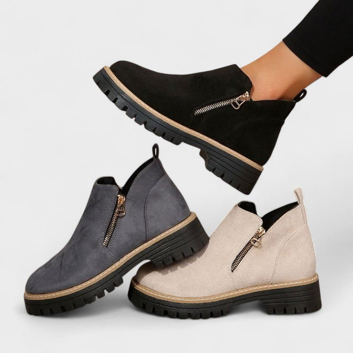 Scarpe stivaletto da donna nere, con doppia zip laterale e suola carrarmato antiscivolo, moda inverno.